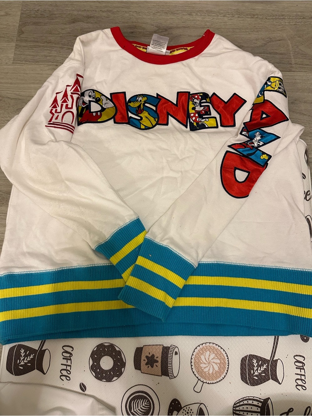Disney White Long-Sleeve Pullover with Red Neckline and Blue & Yellow Stripes
